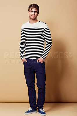 Buy stock photo Fashion, confidence and portrait of man in studio in trendy, stylish and casual clothes on beige background. Happy, attractive and person with stripe style for positive attitude, pride and smile