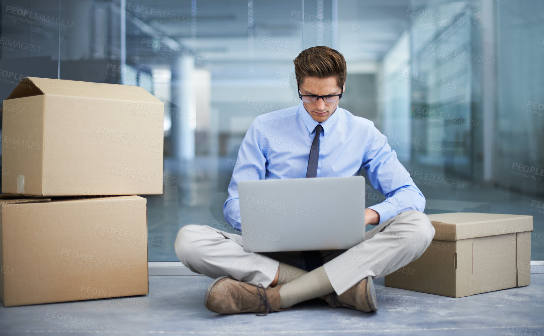 Buy stock photo Moving box, office laptop and man typing business report, statistics analysis or search online, internet or website info. Relocation, cardboard boxes and male businessman, employee or person working