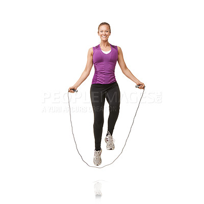 Buy stock photo Portrait of an attractive young woman skipping in the studio