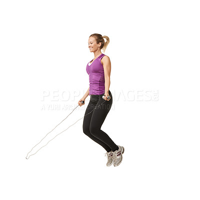 Buy stock photo An attractive young woman skipping