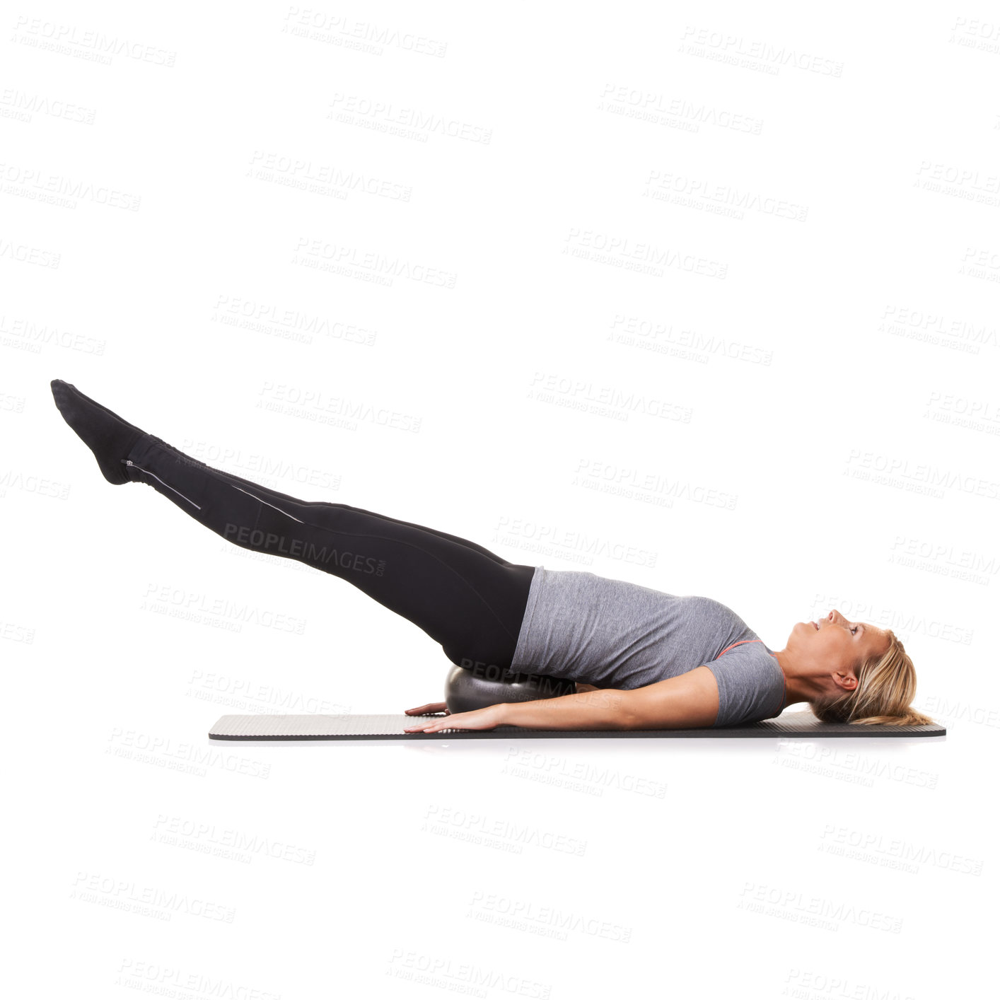 Buy stock photo Woman, exercise ball and back health on yoga mat for workout performance, wellness or white background. Female person, gym equipment and pilates fit in studio for mockup space, balance or stretching