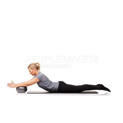 Buy stock photo Woman, exercise ball and stretching on yoga mat or workout performance, pilates wellness or white background. Female person, gym equipment and fitness in studio for mockup space, challenge or balance