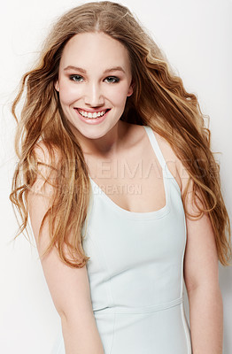 Buy stock photo Smiling young woman posing against a white background