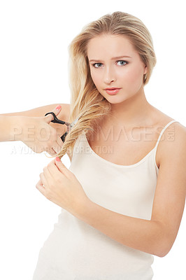 Buy stock photo A unsure young beauty about to chop of her hair