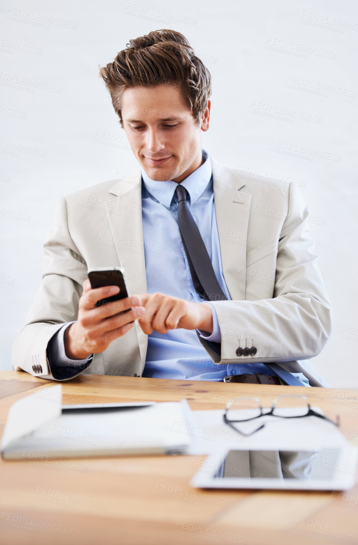 Buy stock photo Businessman, phone and networking or texting in office, connection and contact for company. Male person, professional and communication or mobile application, technology and smile for discussion