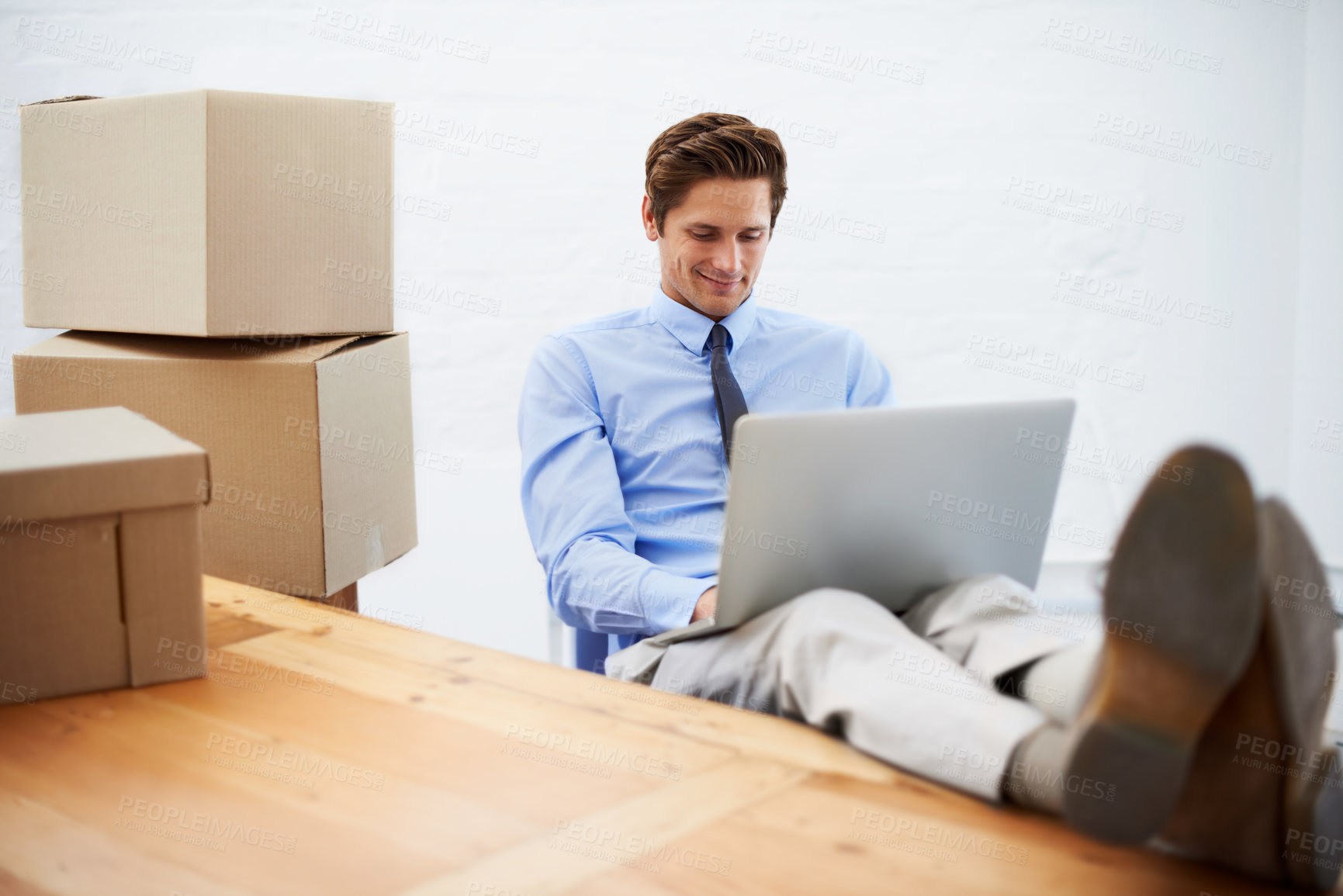 Buy stock photo Businessman, shipping and smiling on laptop, entrepreneur and online logistics for courier. Happy male person, professional and delivery for company distribution, relax and package or internet