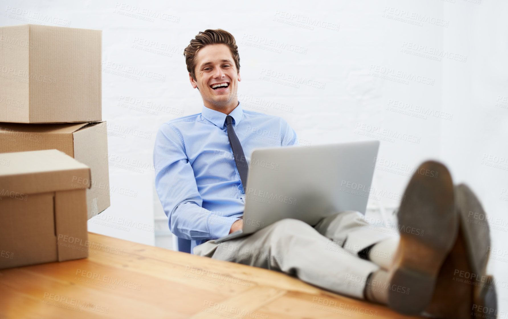Buy stock photo Businessman, moving boxes and happy on laptop, portrait and online logistics for courier delivery. Male person, professional and laughing for company distribution, package and shipment by internet