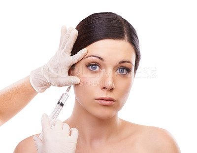 Buy stock photo Woman, portrait and syringe for plastic surgery in studio for injection, chemical and product by white background. Girl patient, surgeon and needle for change, transformation and results with beauty