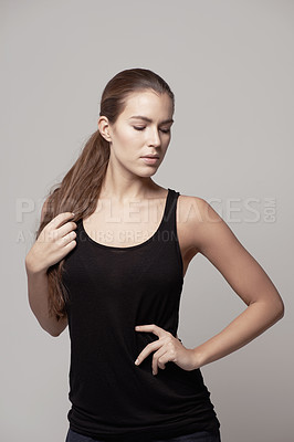 Buy stock photo Woman, fitness and confidence for exercise, workout or training with sportswear against a gray studio background. Confident female person or model posing with slim and healthy body on backdrop