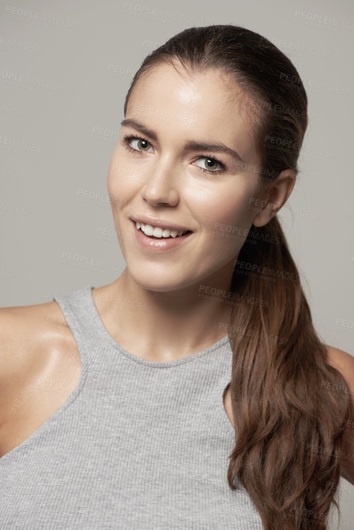 Buy stock photo Happy woman, portrait and smile for fitness, exercise or cardio workout against a grey studio background. Face of fit, active and sweaty female person or model smiling in sportswear or exercising