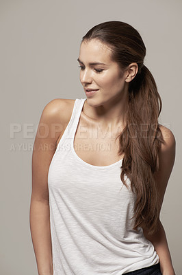 Buy stock photo Fashion, casual and profile of a woman in a studio with a trendy, stylish and apparel outfit. Happy, smile and female model with cool style, long hair and positive mindset isolated by gray background