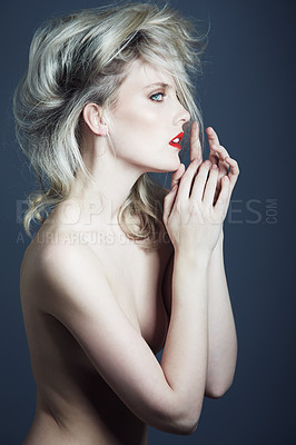 Buy stock photo Studio shot of a gorgeous young woman posing in the nude against a gray background