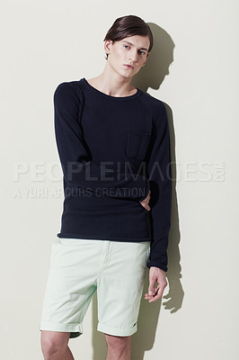 Buy stock photo A handsome young man with elegant facial features posing for a studio shoot