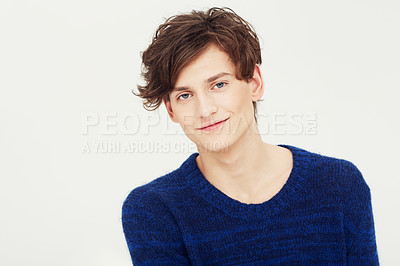 Buy stock photo Portrait of a fresh-faced young man smiling at you in studio