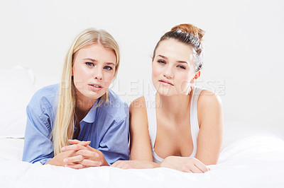 Buy stock photo Portrait, friends and relax on bed together for wellness, social and natural glow for sleepover in mockup. Women, face and positive with beauty cosmetics, health and vacation getaway in apartment
