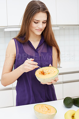 Buy stock photo Woman, cantaloupe and fruit on table in kitchen with health, nutrition and diet in home. Happy, person and melon for breakfast, snack or healthy food in morning to digestion, detox or benefits
