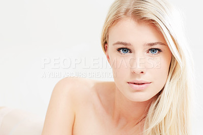 Buy stock photo A beautiful young blonde woman with bare shoulders looking at the camera - copyspace