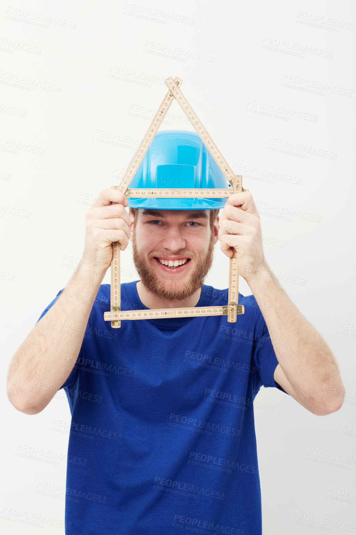 Buy stock photo Carpenter man, ruler and studio portrait with smile, security and helmet for construction by white background. Person, handyman or architect with measuring, maintenance and building in wood industry