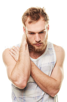 Buy stock photo A young man wearing a vest and looking depressed isolated on white