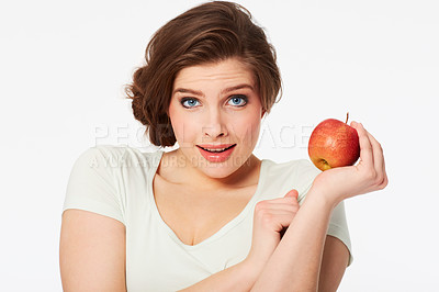 Buy stock photo Portrait of a pretty brunette woman holding a red apple
