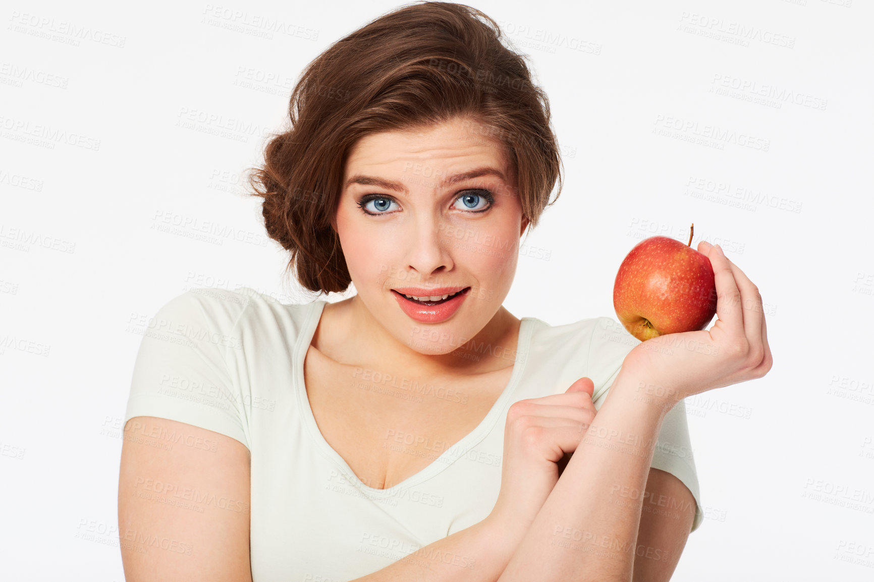 Buy stock photo Portrait of a pretty brunette woman holding a red apple