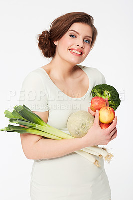 Buy stock photo Pretty brunette woman holding healthy veggies while isolated on white