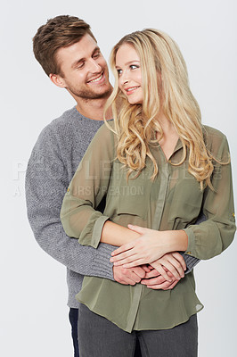 Buy stock photo Studio portrait of a happy young couple
