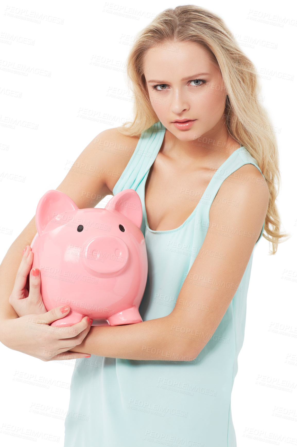 Buy stock photo A gorgeous young woman hugging her piggy bank protectively while isolated on a white background