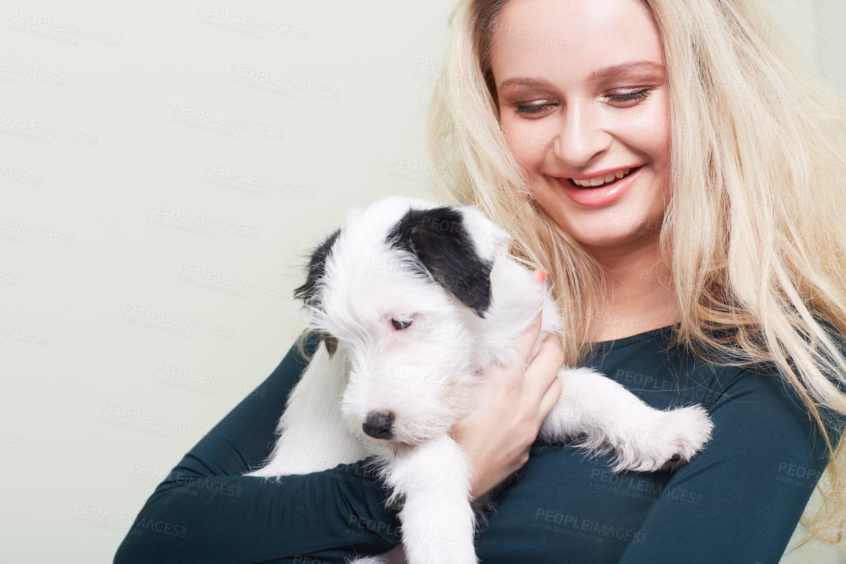 Buy stock photo Happy, hug and woman with a dog in her home with love, care and bonding, trust and having fun together. Puppy, animal and female person embracing Jackopoo pet in a house with support and security 