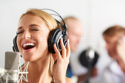 Buy stock photo Music, singing and woman with microphone, headphones and band performance with talent. Recording studio, smile and happy girl musician live streaming voice for record label, sound and audio broadcast