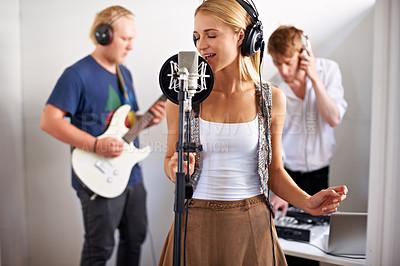 Buy stock photo Professional, musician and woman with microphone, headphones and band performance with talent. Recording studio, art and girl singer live streaming for music record label, sound and audio broadcast.