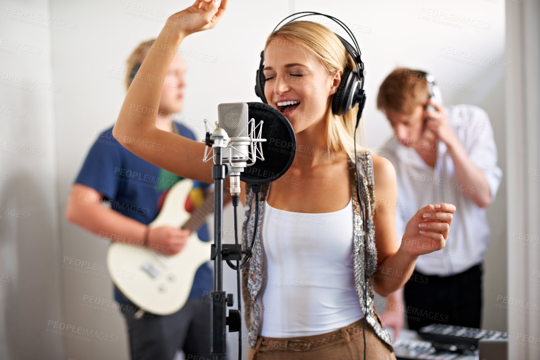 Buy stock photo Professional, musician and happy woman with microphone, headphones and band performance with talent. Recording studio, art and girl singer live streaming for music label, sound and audio broadcast.