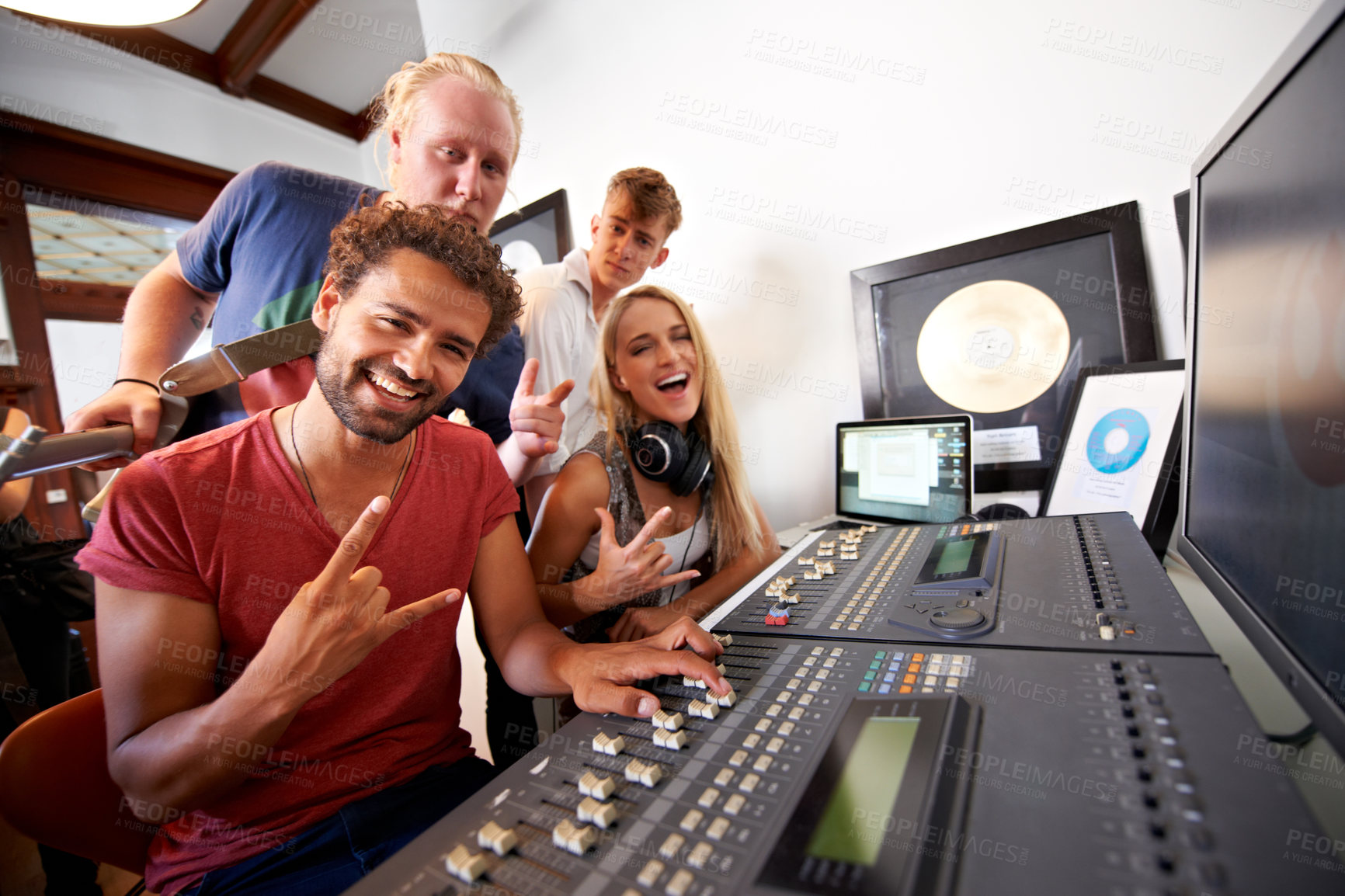 Buy stock photo Recording studio, rock sign and portrait of people for music, radio and audio with musical instruments. Hand emoji, soundboard and happy men and women with sound engineer or producer to record media