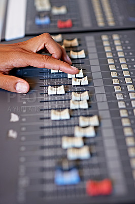 Buy stock photo Hand, mixing and sound board in recording studio with dj, technology and media on desk. Music, deck and person editing with equipment for audio, production and moving switch on console for radio song