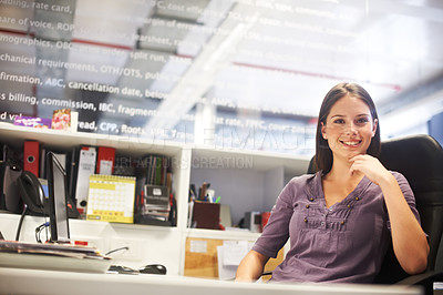 Buy stock photo Cropped portrait of a young businesswoman sitting at her desk