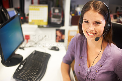 Buy stock photo Cropped portrait of a young businesswoman wearing a headset at her desk
