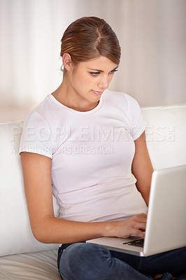 Buy stock photo Woman, laptop and relax on sofa for remote work, reading blog post and social media subscription at home. Freelancer at computer for online shopping, elearning research and digital download on couch