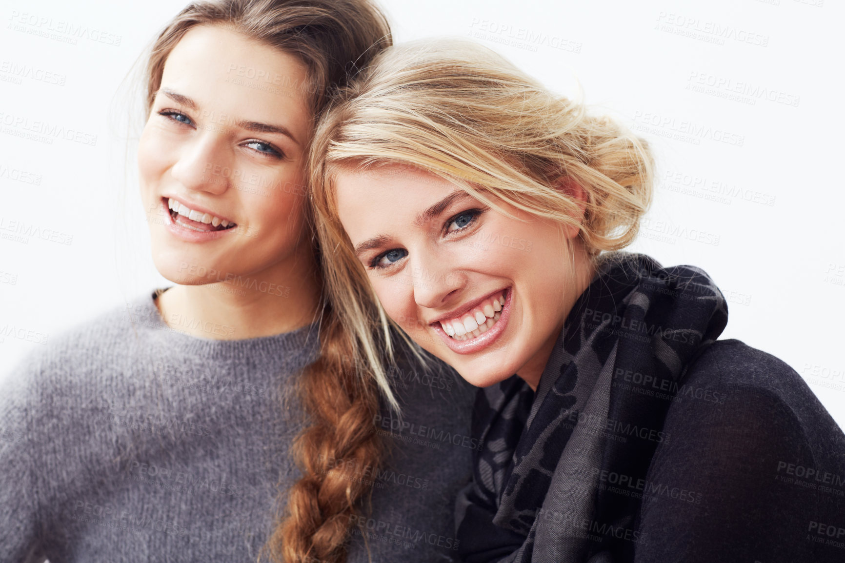 Buy stock photo Portrait of two young friends smiling at the camera