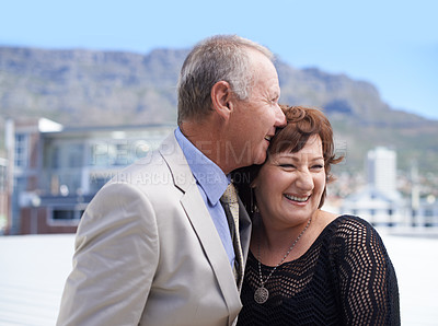 Buy stock photo A mature couple being affectionate against a scenic background