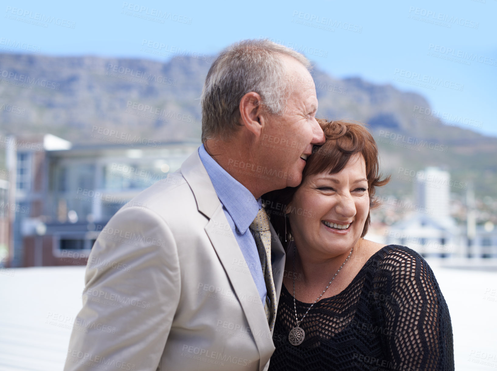 Buy stock photo A mature couple being affectionate against a scenic background