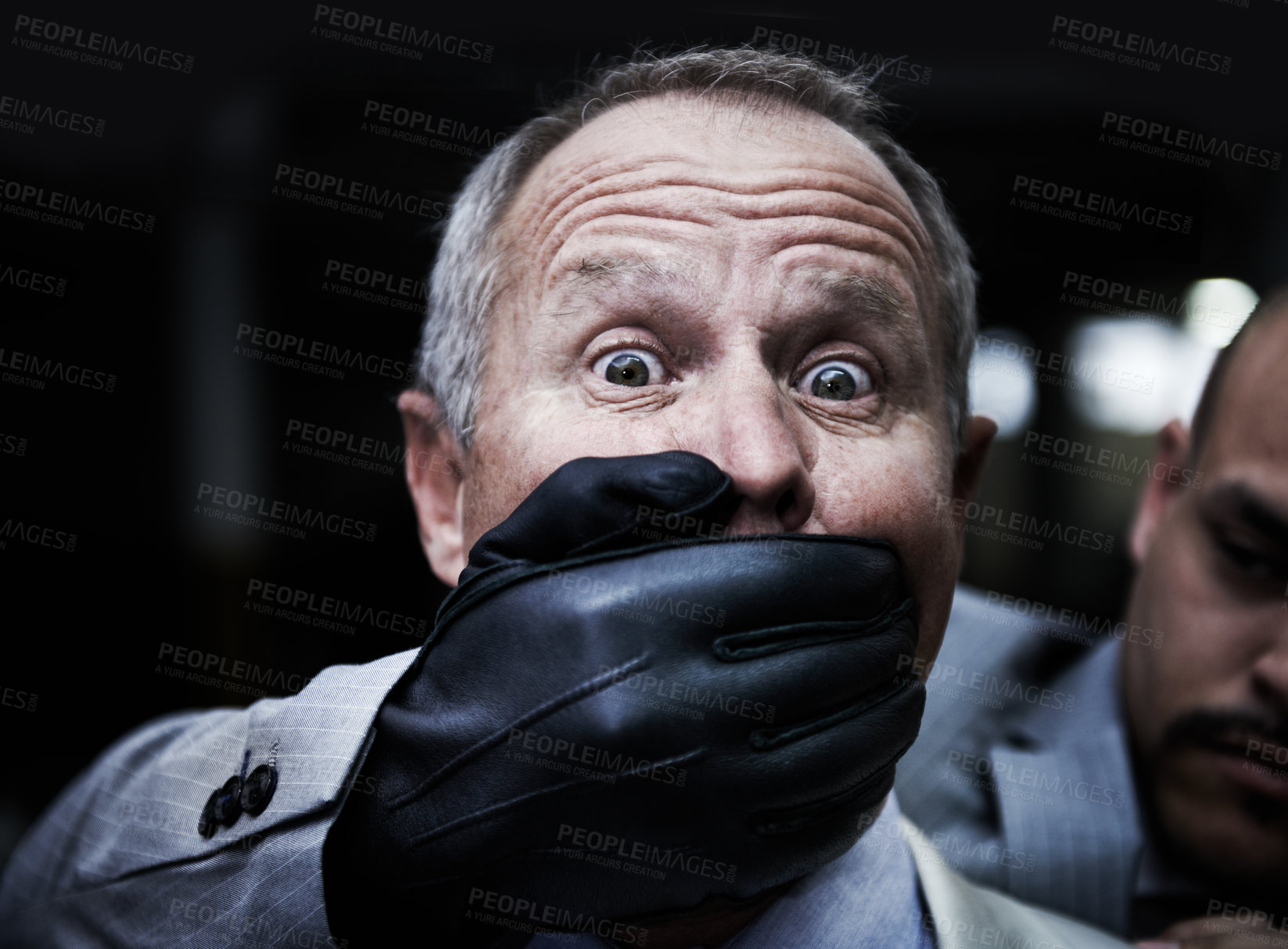 Buy stock photo Portrait of a shocked businessman caught unaware by an assailant in the parkade