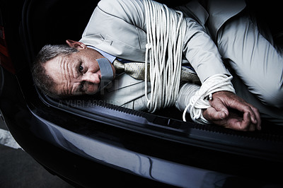 Buy stock photo Car boot, crime and portrait of business man with tape, rope and kidnap danger in parking lot. Fear, stress and face of male victim in a vehicle trunk with anxiety, horror or panic, scared or ransom