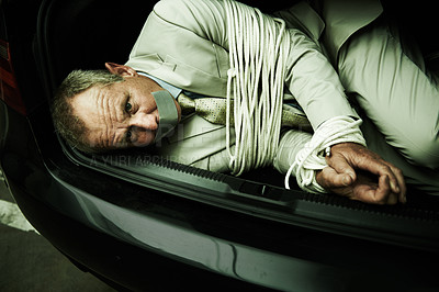 Buy stock photo Car boot, hostage or portrait of business man with tape, rope and kidnap danger in parking lot. Fear, stress and face of male victim in a vehicle trunk with anxiety, horror or crime, scared or ransom