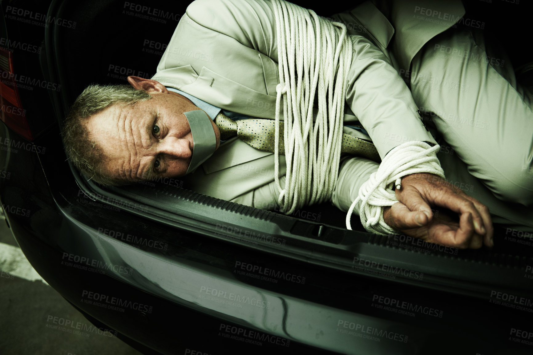 Buy stock photo Car boot, hostage or portrait of business man with tape, rope and kidnap danger in parking lot. Fear, stress and face of male victim in a vehicle trunk with anxiety, horror or crime, scared or ransom