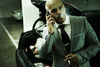 Buy stock photo Mafia, car and man with hostage in trunk for negotiation, kidnapping ransom or crime. Phone call, gangster criminal and business person smoking in boot for abduction, danger or robbery in parking lot