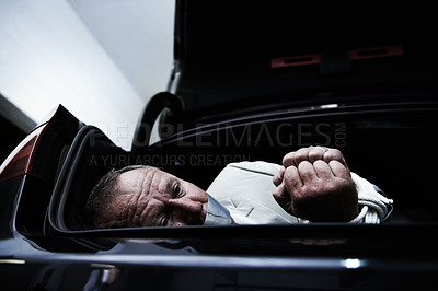 Buy stock photo Car boot, crime and sad business man with tape, rope and kidnap danger in parking lot. Fear, stress and face of mature male victim in a vehicle trunk with anxiety, horror or panic, scared or ransom