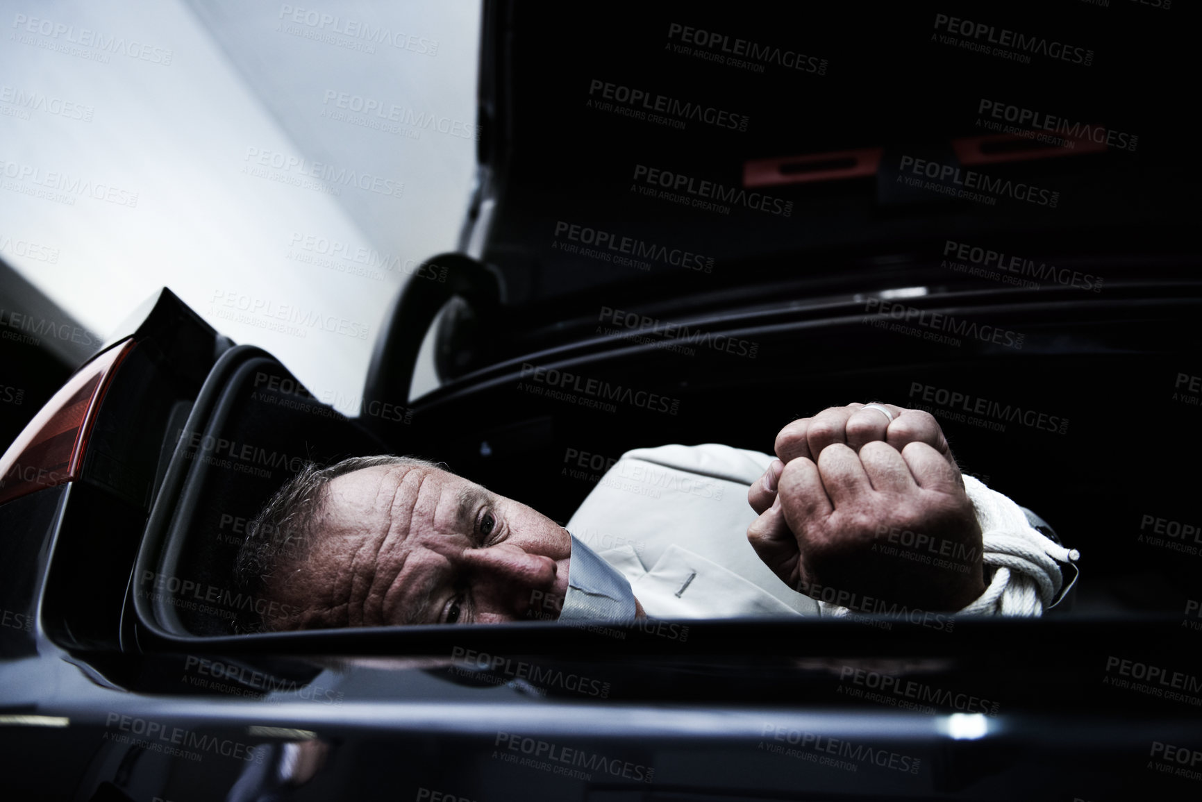 Buy stock photo Car boot, crime and sad business man with tape, rope and kidnap danger in parking lot. Fear, stress and face of mature male victim in a vehicle trunk with anxiety, horror or panic, scared or ransom