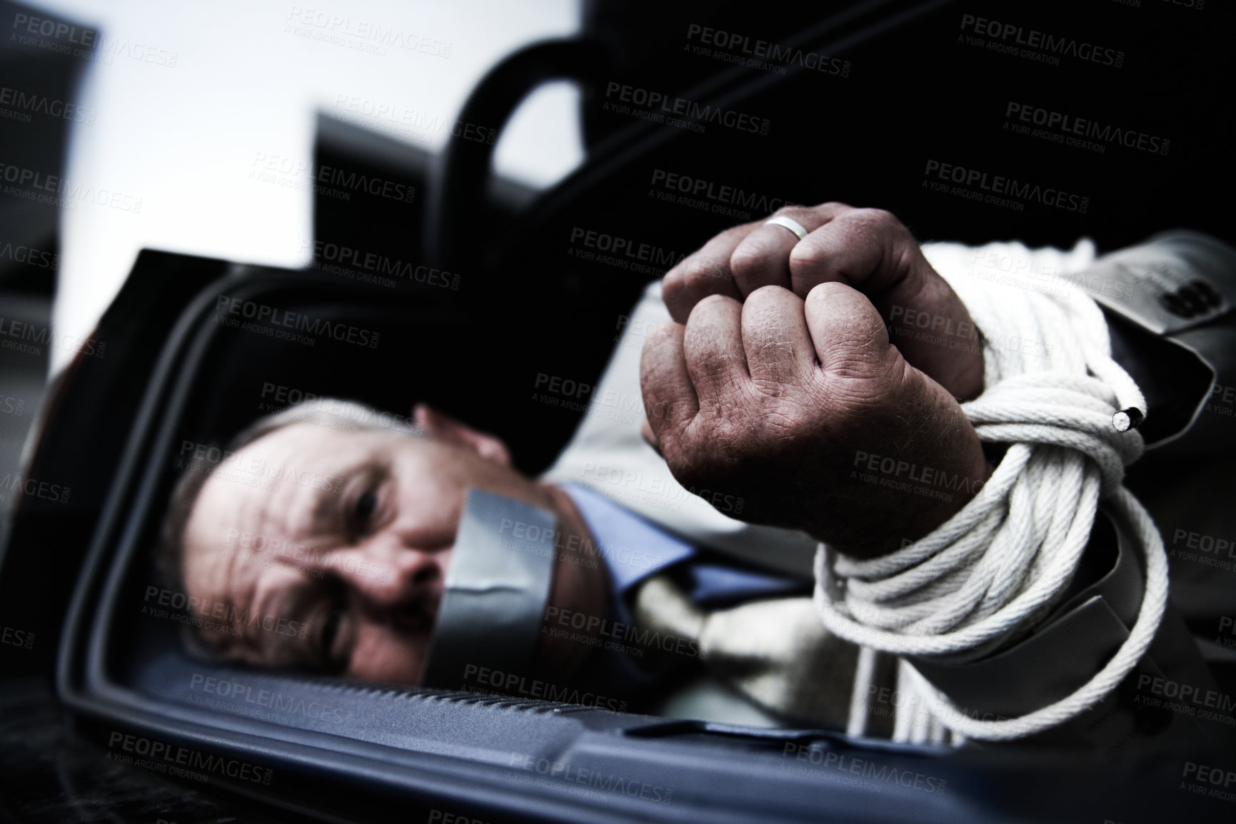 Buy stock photo Car boot, kidnap and portrait of sad business man with tape, rope or crime danger in parking lot. Fear, stress and face of male victim in vehicle trunk with anxiety, horror or panic, scared or ransom