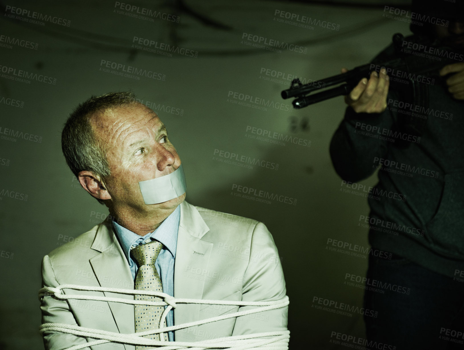 Buy stock photo Business man, kidnap and hands with gun for crime, ransom and negotiation in terror, abduction or danger at night. Criminal, scared person or mature hostage in fear, tied up and duct tape in shooting