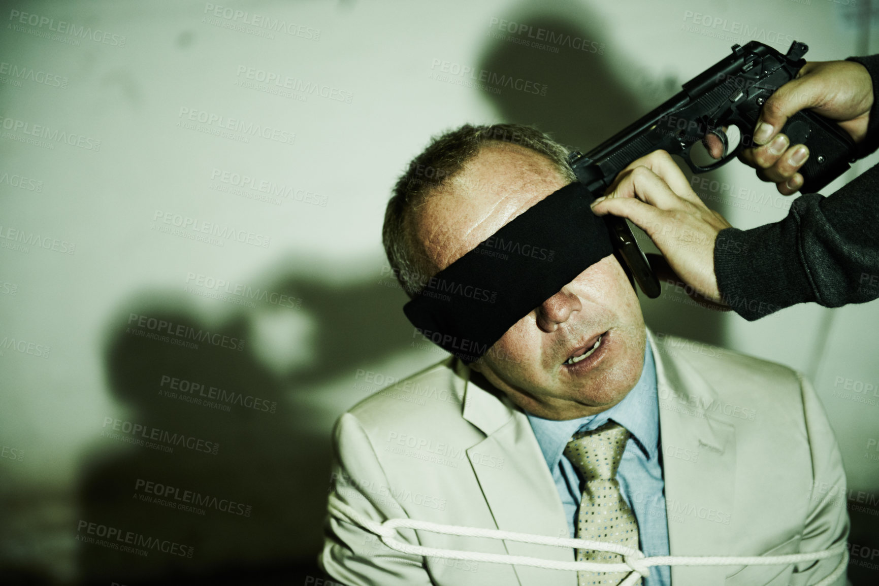 Buy stock photo Man, business and gun or kidnapped with rope or blindfolded, phone call for ransom hostage. Male person, criminal and fear weapon on chair for gangster interrogation, robber victim or mafia abduction